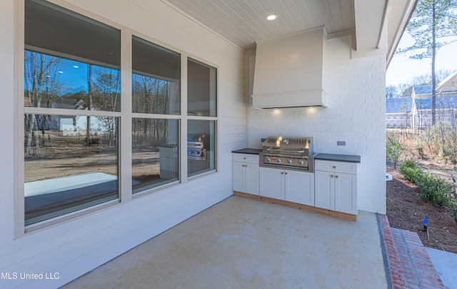 view of patio / terrace with an outdoor kitchen and area for grilling