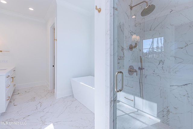 bathroom with vanity, ornamental molding, and independent shower and bath