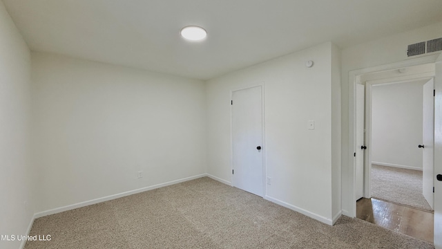 spare room with carpet floors and baseboards