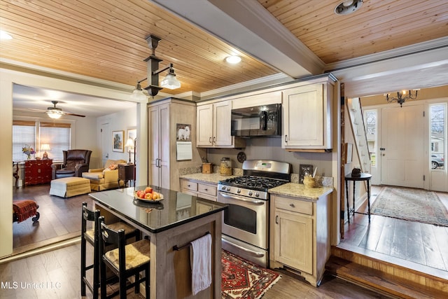 kitchen featuring gas range, wood ceiling, ornamental molding, hardwood / wood-style floors, and black microwave