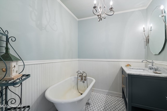 bathroom featuring a freestanding tub, ornamental molding, and wainscoting