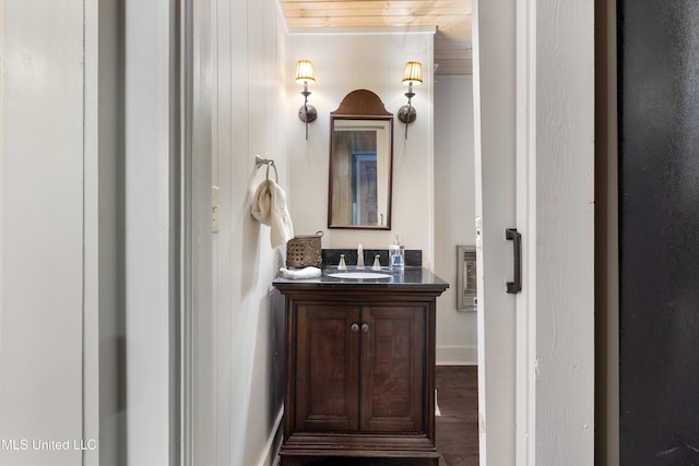 bathroom featuring visible vents, wood finished floors, and vanity