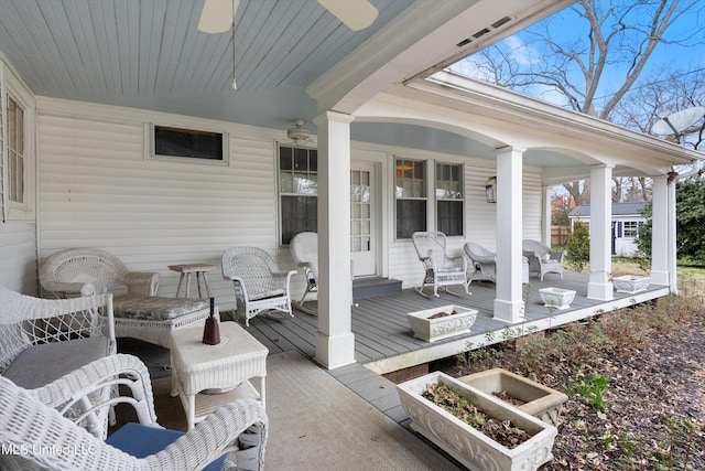 wooden terrace featuring a fire pit