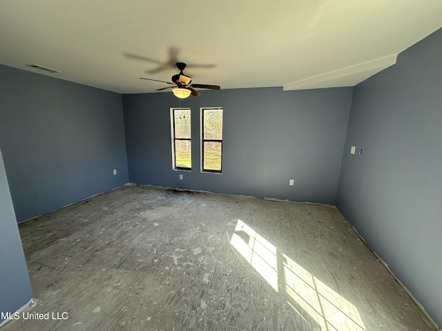 spare room with visible vents and ceiling fan