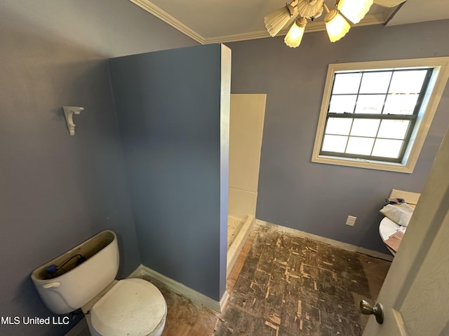 full bath with a ceiling fan, baseboards, a shower stall, crown molding, and toilet