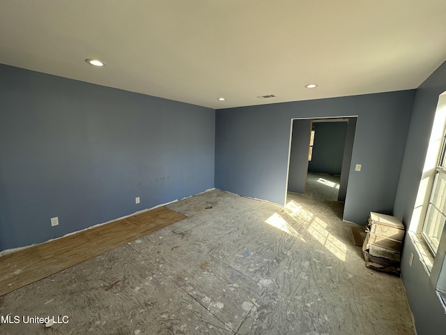 unfurnished bedroom featuring recessed lighting and visible vents