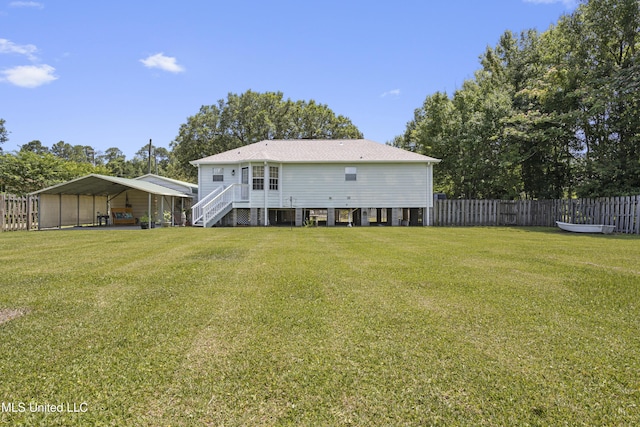 866 Washington St, Bay Saint Louis, MS 39520 - rear view of house featuring a carport and stairs