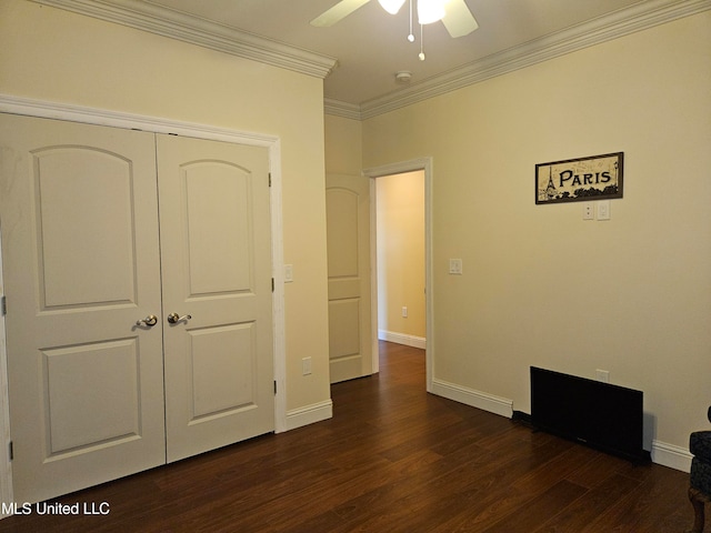 unfurnished bedroom with a closet, ceiling fan, ornamental molding, and dark hardwood / wood-style flooring