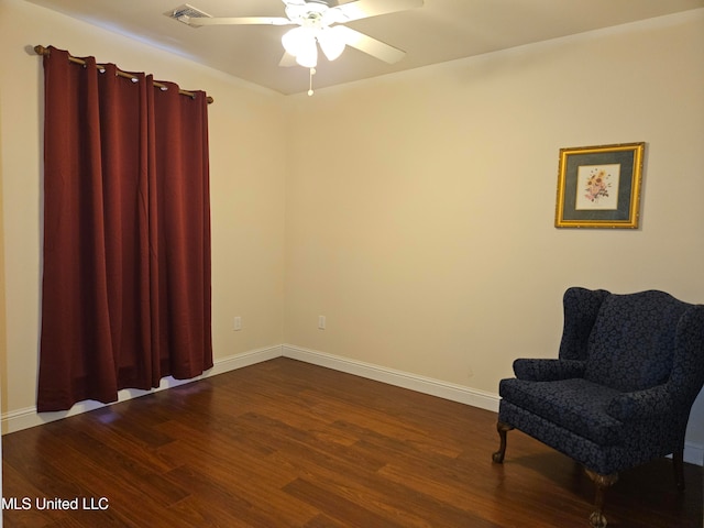 living area featuring ceiling fan and hardwood / wood-style floors