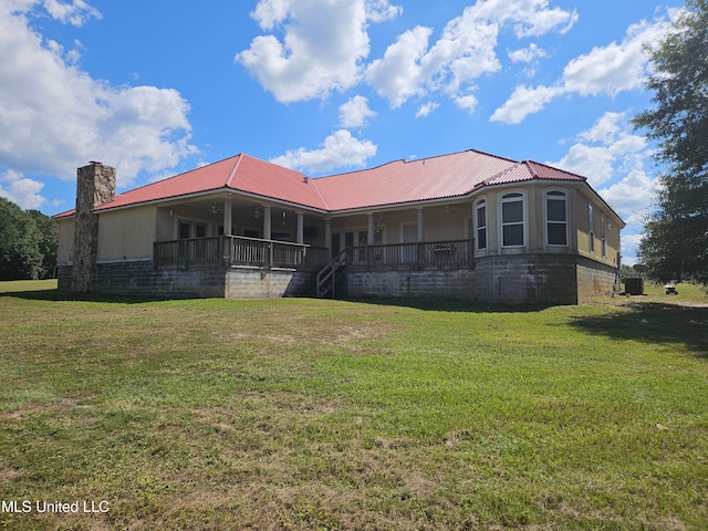 back of property with a yard