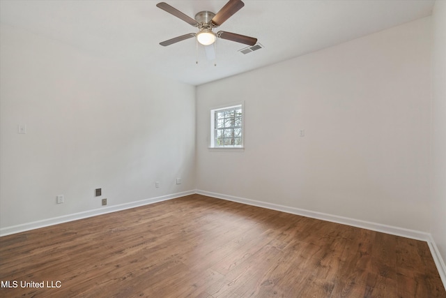 spare room featuring ceiling fan and hardwood / wood-style flooring