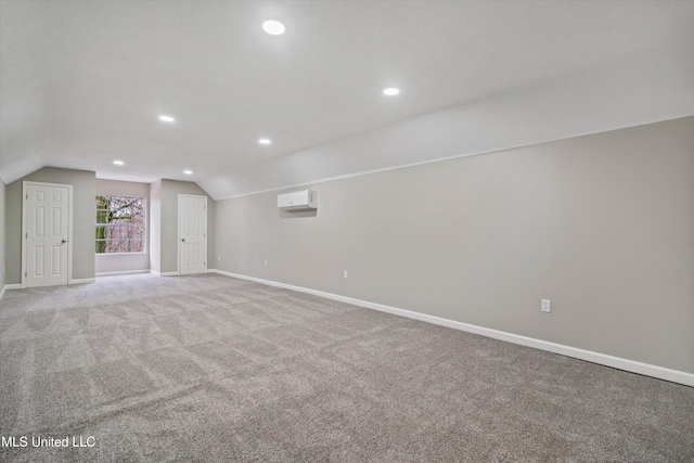 interior space with light carpet and a wall unit AC