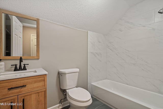 full bathroom featuring tiled shower / bath combo, tile patterned floors, a textured ceiling, toilet, and vanity