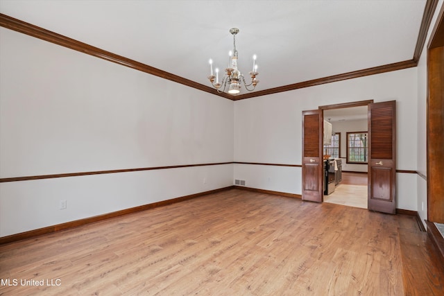 unfurnished room featuring ornamental molding, light hardwood / wood-style floors, and a notable chandelier