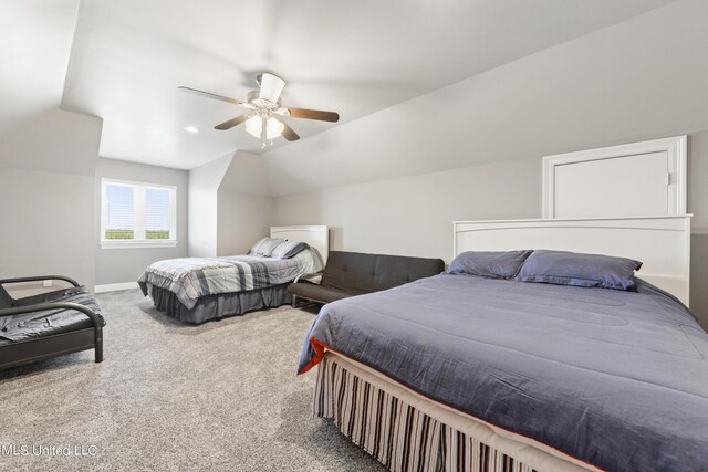 bedroom with carpet floors, baseboards, vaulted ceiling, and a ceiling fan