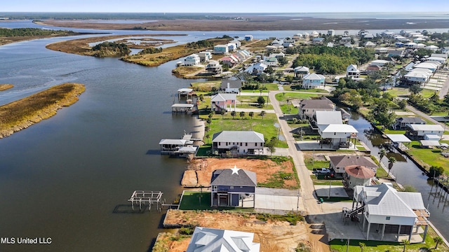 bird's eye view featuring a water view and a residential view