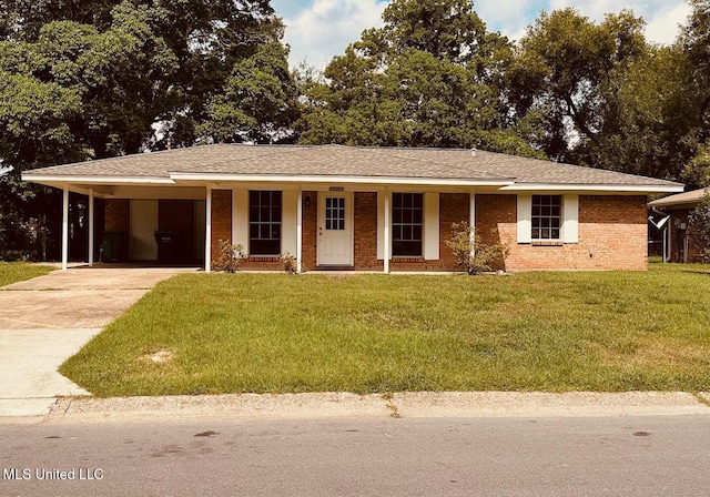 143 James Dr, Gulfport, MS 39503 - ranch-style house featuring driveway, a front yard, an attached carport, and covered porch