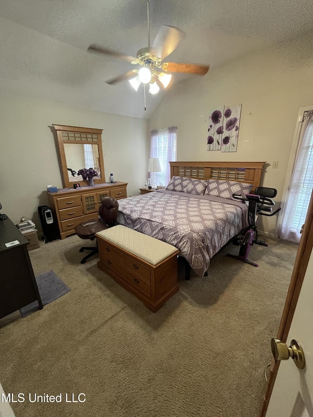 7605 Davis Pkwy, Southaven, MS 38671 - bedroom featuring a textured ceiling, lofted ceiling, carpet floors, and ceiling fan