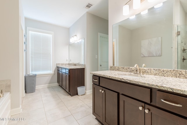 bathroom featuring vanity, separate shower and tub, and tile patterned flooring