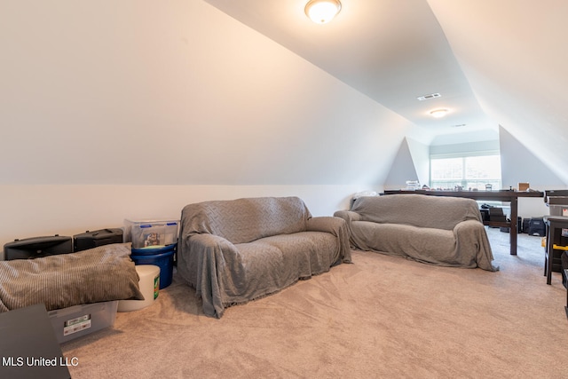 carpeted bedroom with vaulted ceiling