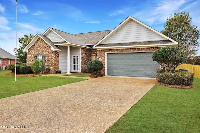 view of front of home featuring a front yard and a garage