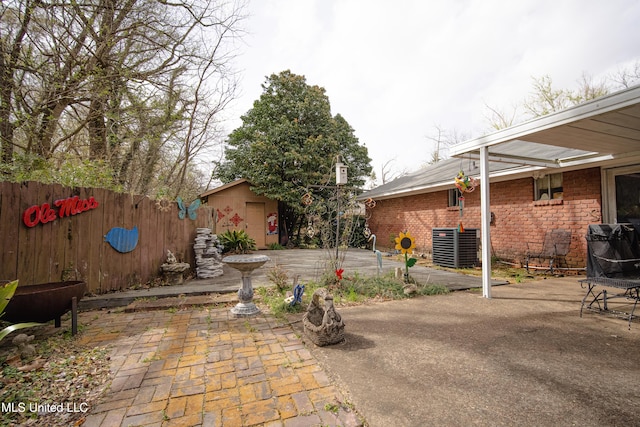view of patio featuring fence