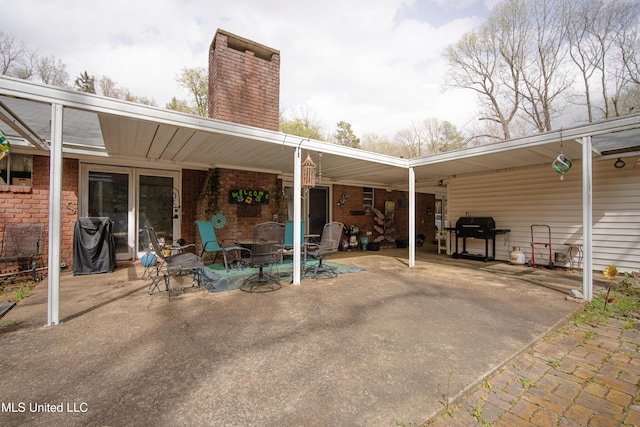 view of patio with an attached carport and grilling area