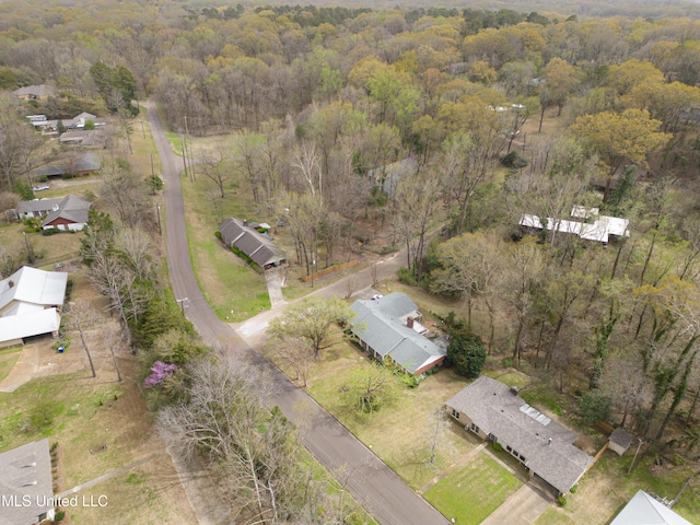 drone / aerial view with a view of trees