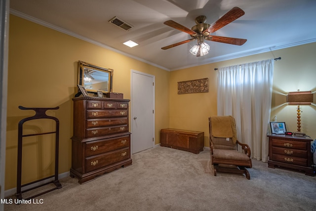 sitting room featuring visible vents, crown molding, ceiling fan, and carpet