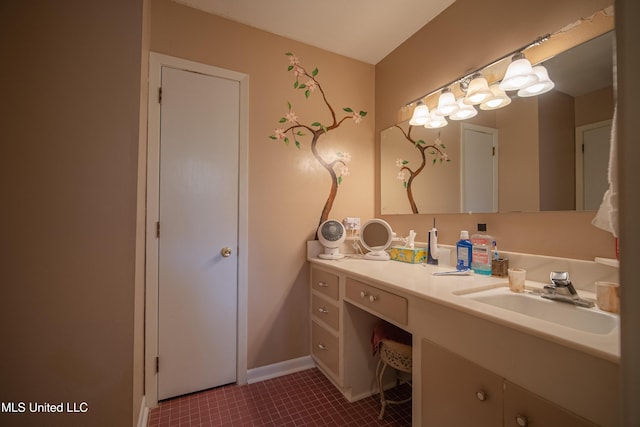 bathroom featuring vanity and baseboards