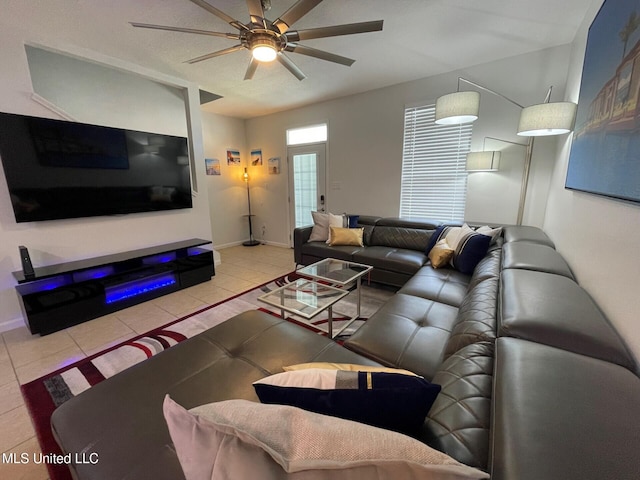 1276 Century Oaks Dr Unit B, Gulfport, MS 39507 - tiled living area with a ceiling fan, a glass covered fireplace, and baseboards