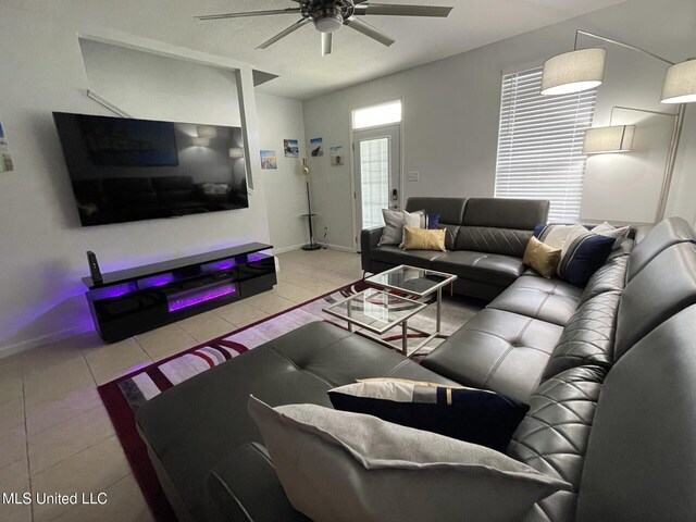 1276 Century Oaks Dr Unit B, Gulfport, MS 39507 - living area featuring a ceiling fan, tile patterned flooring, and baseboards