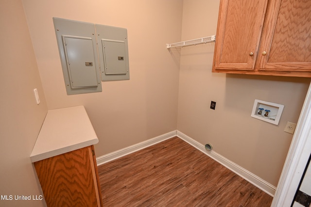 clothes washing area with cabinets, electric panel, washer hookup, dark hardwood / wood-style floors, and electric dryer hookup