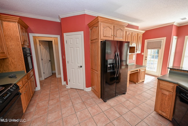 kitchen featuring crown molding, black appliances, and light tile patterned floors