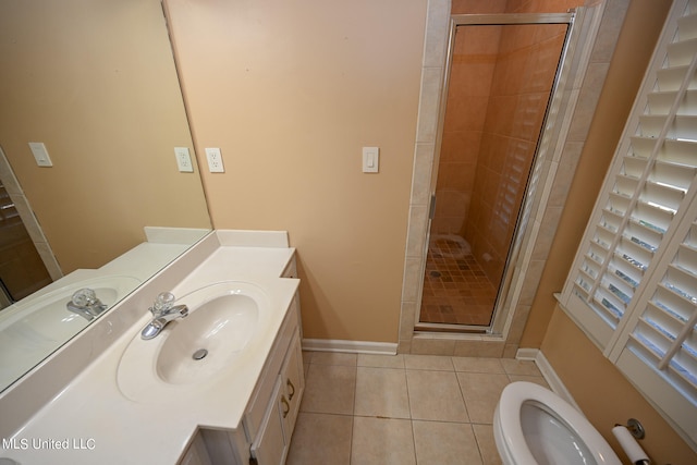 bathroom featuring vanity, toilet, tile patterned floors, and walk in shower