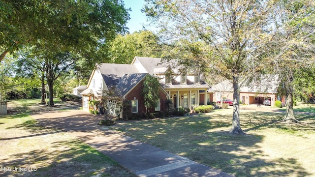 view of front facade with a garage and a front lawn