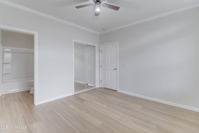 1515 E Beach Blvd Unit 132, Pass Christian, MS 39571 - unfurnished bedroom with light wood finished floors, ornamental molding, connected bathroom, and a ceiling fan