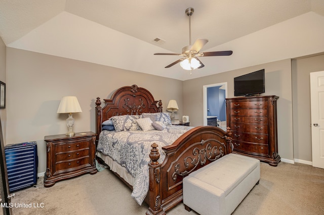 carpeted bedroom with vaulted ceiling and ceiling fan