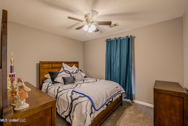 bedroom with carpet flooring and a textured ceiling