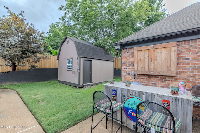 view of patio / terrace with a shed