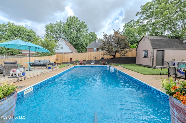 view of swimming pool featuring a storage shed