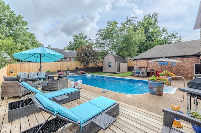 view of swimming pool with a storage shed and a patio