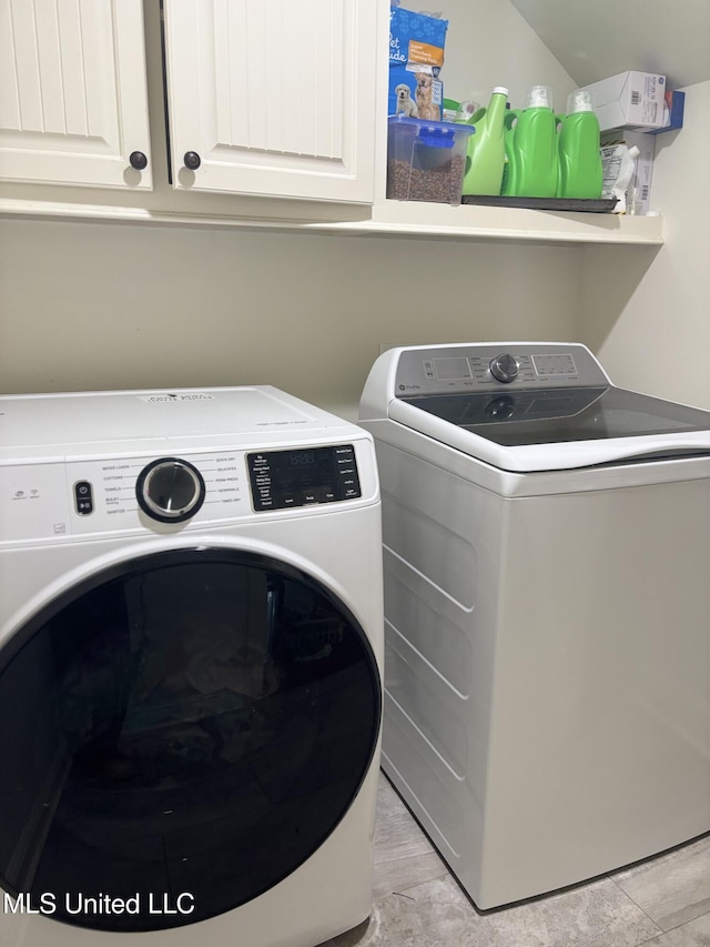 103 Sweetbriar Cir, Canton, MS 39046 - clothes washing area featuring washing machine and clothes dryer and cabinet space