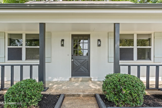 doorway to property featuring covered porch