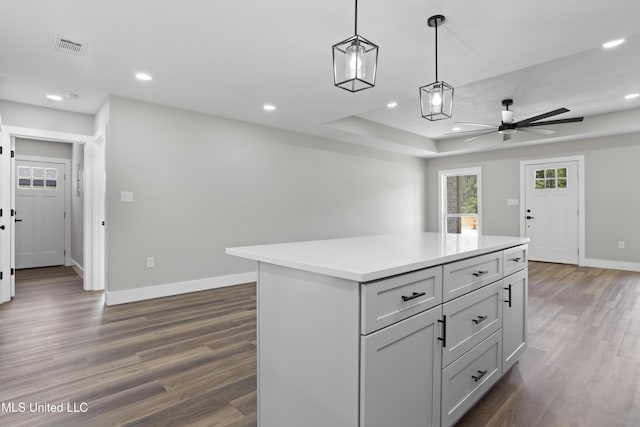 1457 Rue De Courmont, Gautier, MS 39553 - kitchen featuring a ceiling fan, dark wood-type flooring, light countertops, recessed lighting, and decorative light fixtures