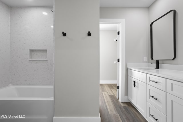 1457 Rue De Courmont, Gautier, MS 39553 - full bath featuring double vanity, wood finished floors, and bathing tub / shower combination