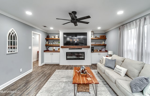 living room featuring ornamental molding, dark hardwood / wood-style floors, and ceiling fan