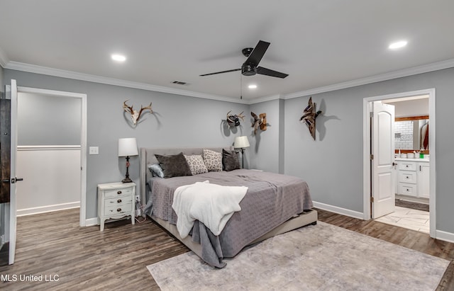 bedroom featuring crown molding, dark hardwood / wood-style floors, and ceiling fan