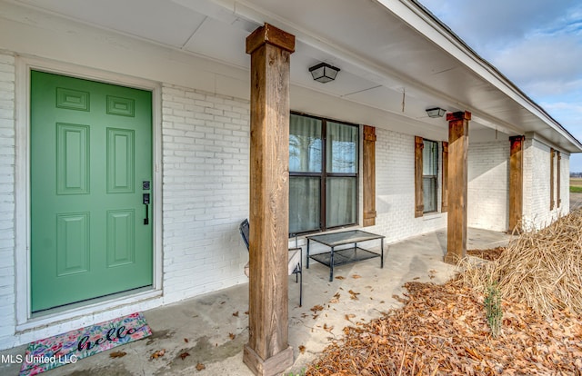 doorway to property with a porch