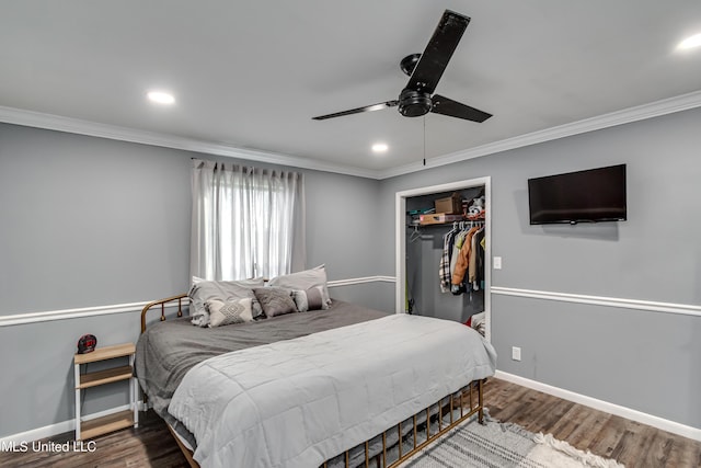 bedroom featuring crown molding, hardwood / wood-style floors, and a closet